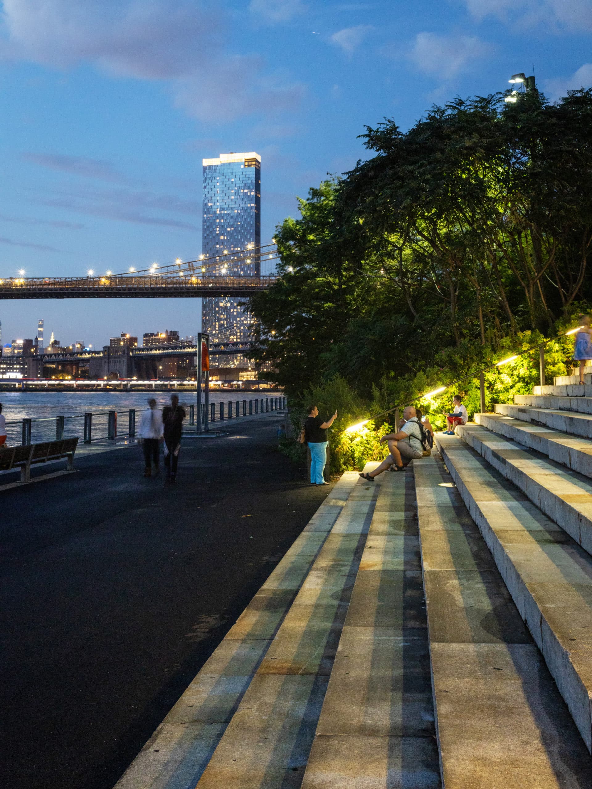 Steps from the Granite Prospect with view of One Manhattan Square at night