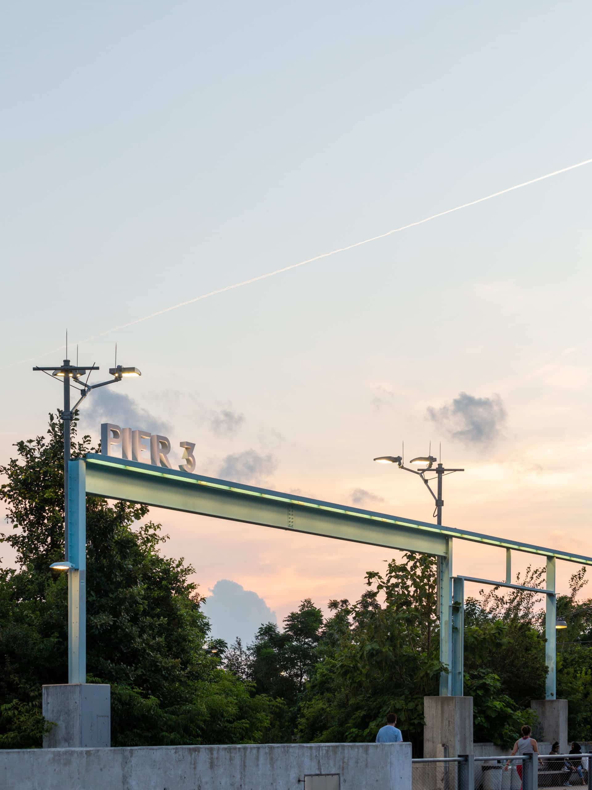 Pier 3 entrance and trees at sunset