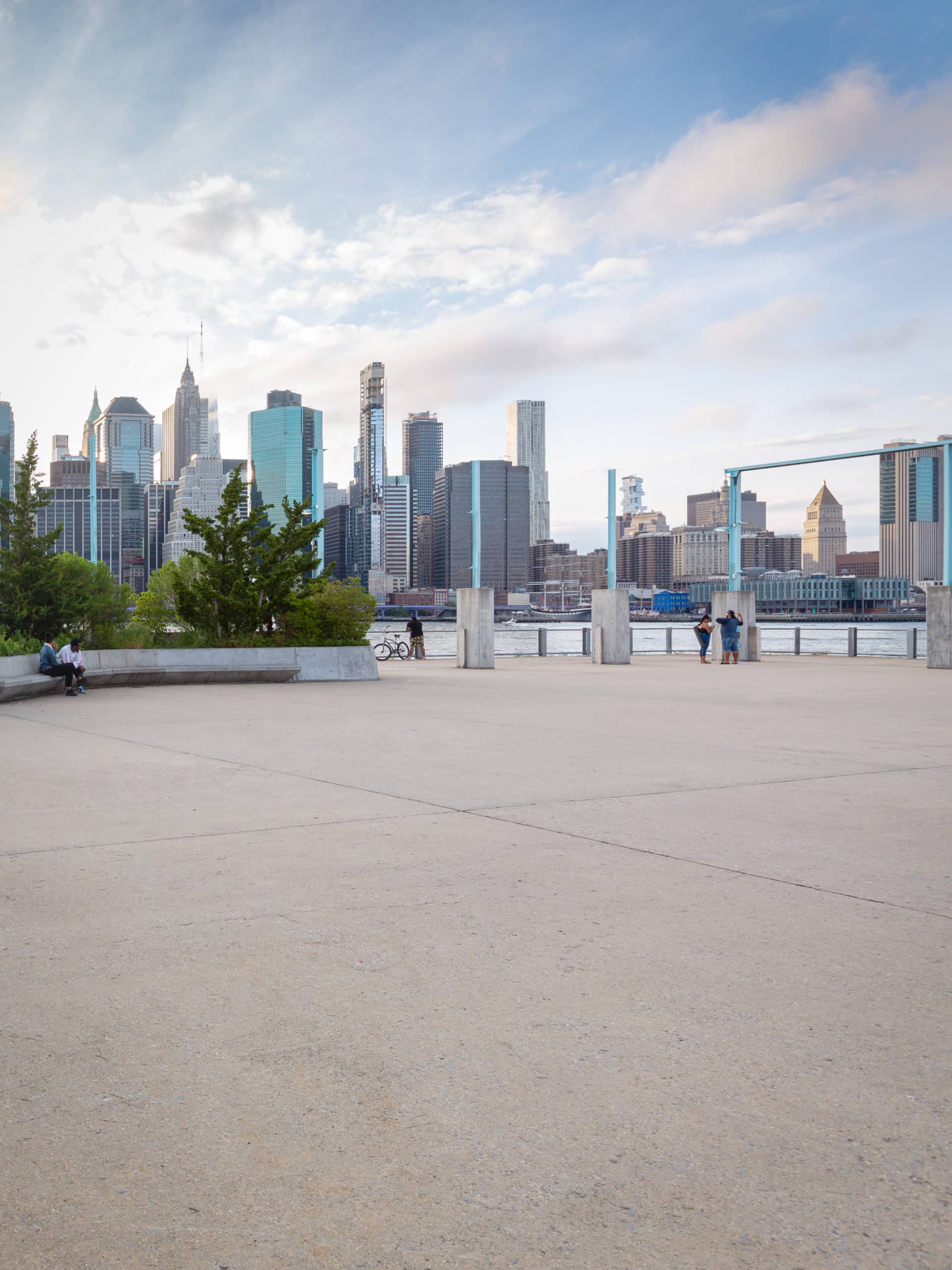 Pier 3 Plaza with view of lower Manhattan at sunset