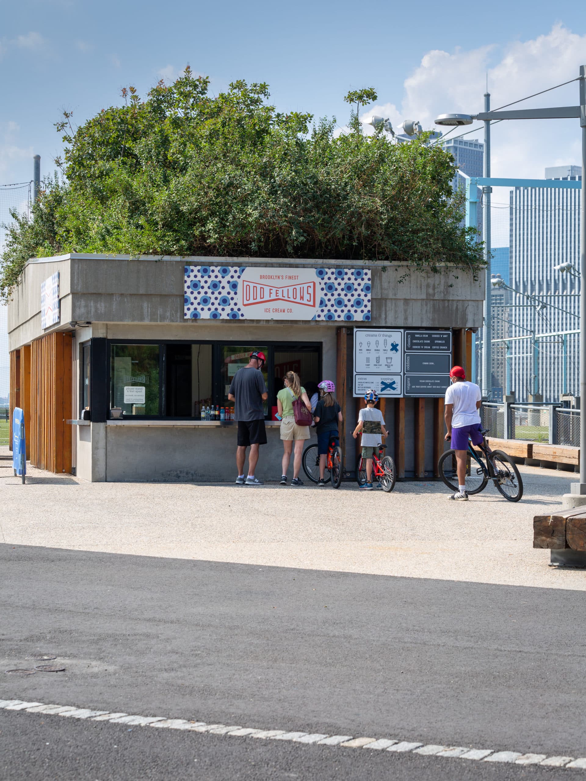 People in line for OddFellows Ice Cream Co. on a sunny day