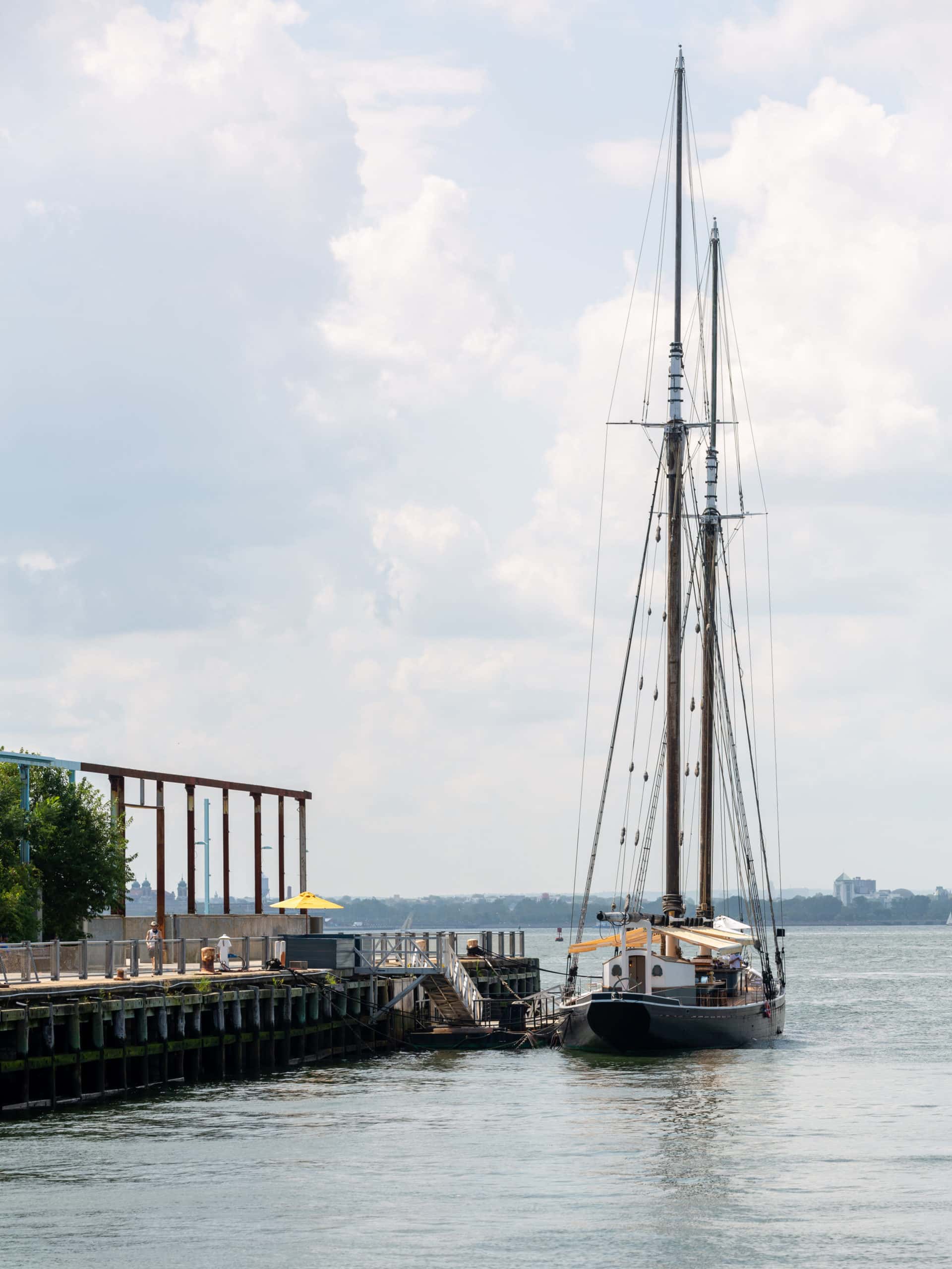 Restaurant aboard historic sailboat Pilot docked at Pier 6 on a sunny day.